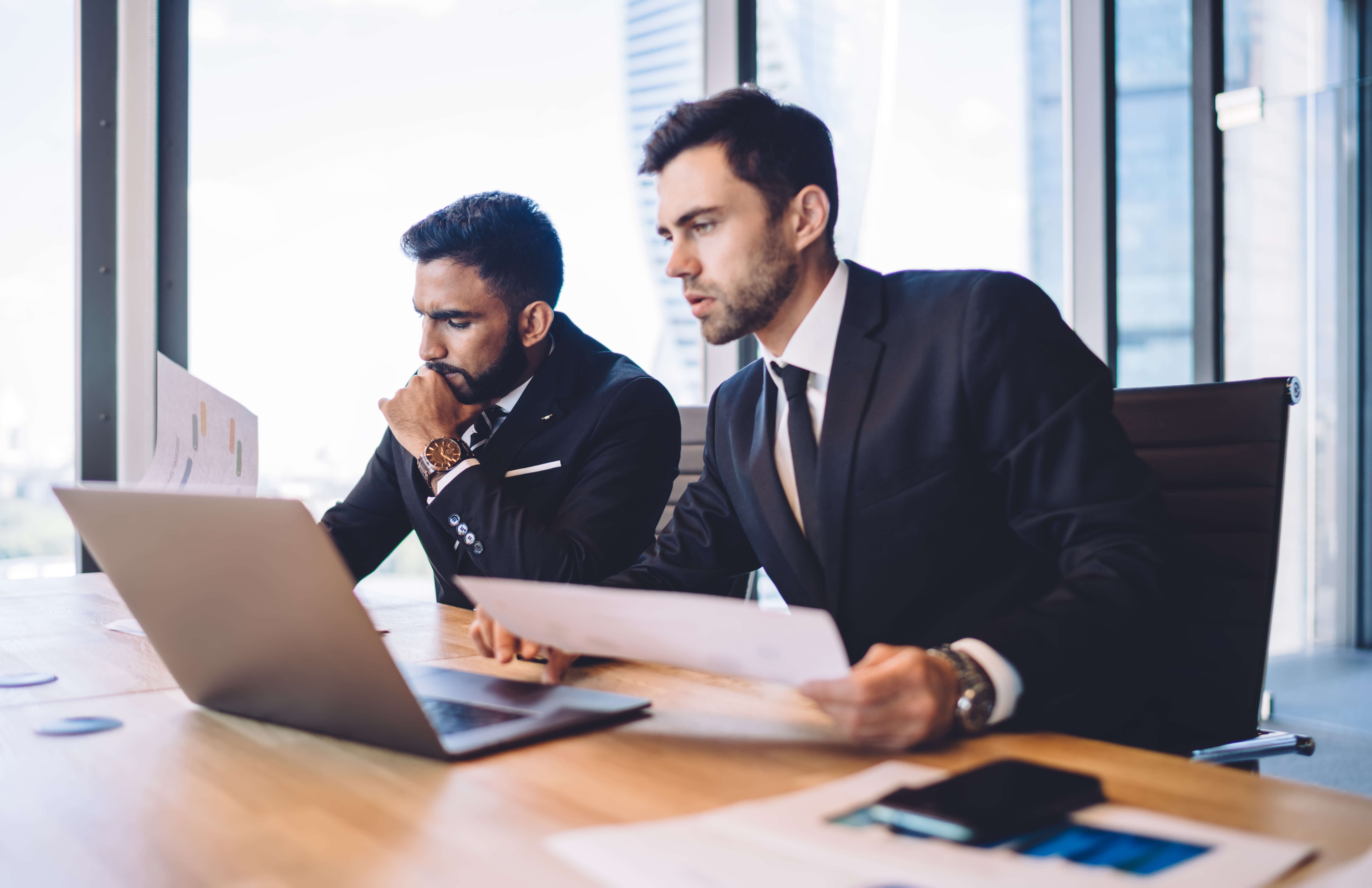 Two digital marketers analyzing their strategy.