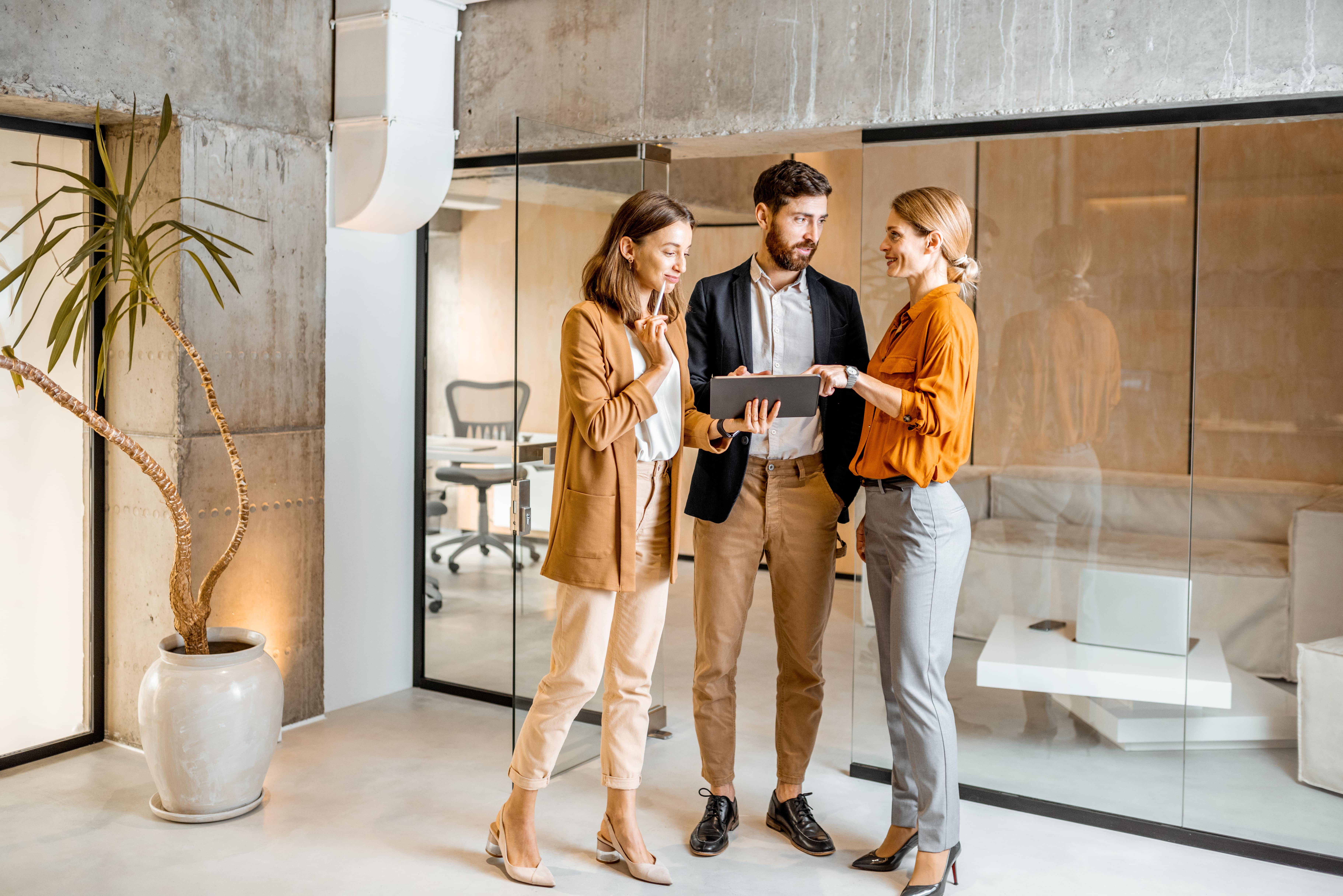 A group of digital marketing professionals looking at data.